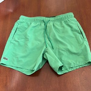 Lacost M’en swim trunks size Small in excellent condition